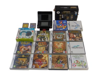 Lot 558 - A Nintendo DS Lite, in black, and games...