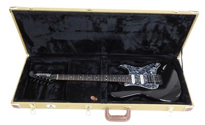 Lot 49 - A Ricardo black electric guitar, cased, 99cm...