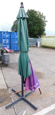 Lot 1673A - A large green patio umbrella with hinged...