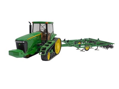 Lot 658 - A Britains Ertl John Deere 8420T tractor, and...