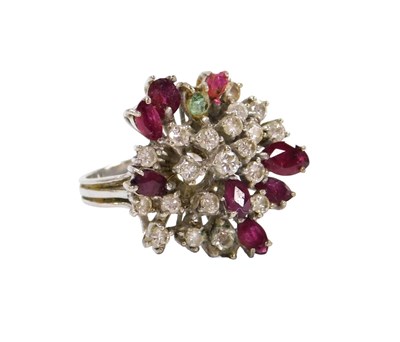 Lot 521 - A ruby and diamond cluster ring, in a multi...