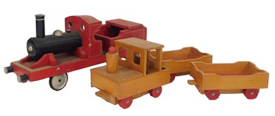 Lot 715 - Two wooden child's pull along trains and...