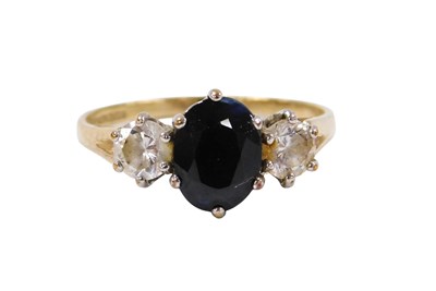 Lot 527 - A 9ct gold sapphire and CZ three stone...