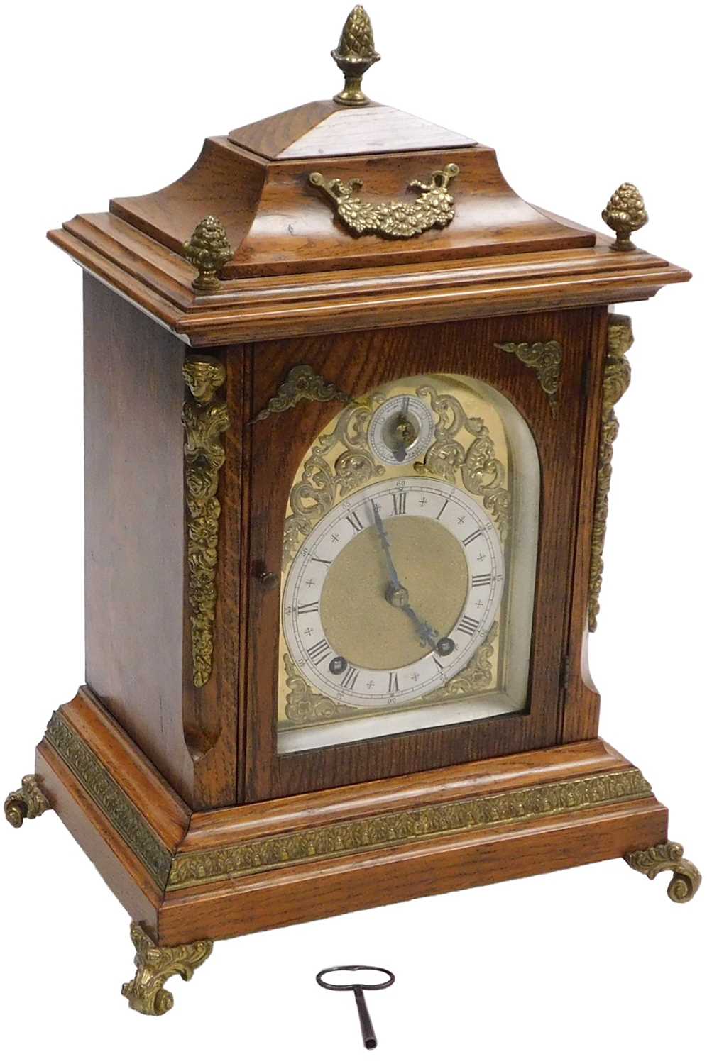 Lot 85 - A late 19thC oak cased mantel clock, arched