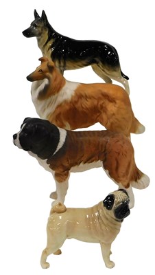 Lot 141 - Four Beswick pottery figures of dogs, glazed...