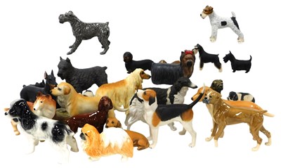 Lot 142 - A group of pottery and resin figures of dogs,...