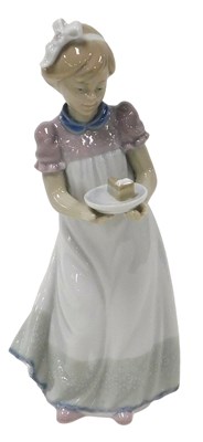 Lot 147 - A Lladro porcelain figure of a girl, modelled...