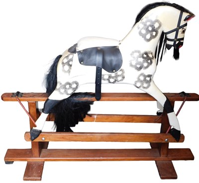 Lot 635 - An Edwardian dappled rocking horse, possibly...