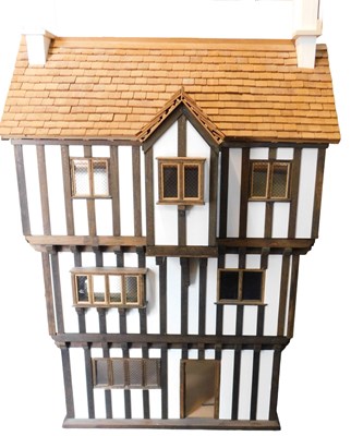 Lot 638 - A hand built Tudor style doll's house, 155cm...