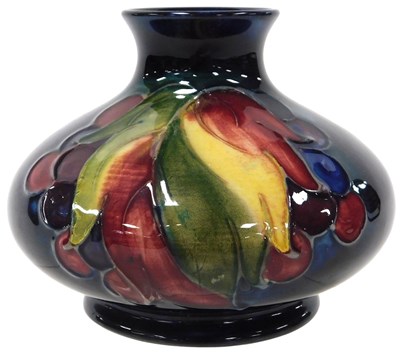 Lot 244 - A Moorcroft pottery Leaf & Berry pattern vase,...