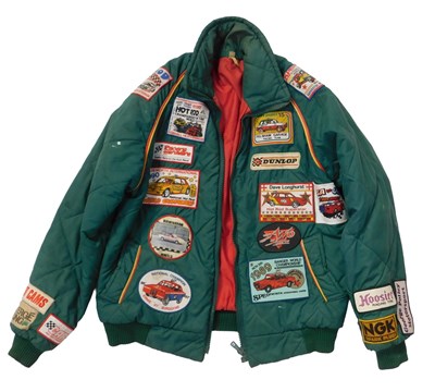 Lot 128 - A green jacket, emblazoned with banger racing...