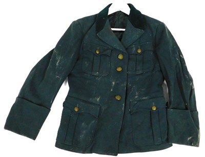 Lot 286 - A green military jacket with velvet collar,...
