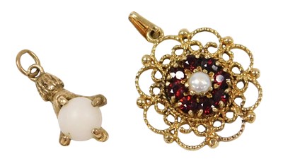 Lot 435 - A 9ct gold garnet and seed pearl pendant, in...