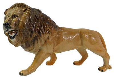 Lot 77 - A Beswick figure modelled as a lion, printed...