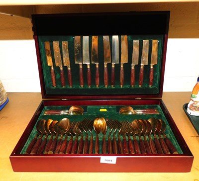 Lot 2094 - An Eastern brass canteen of cutlery, with...