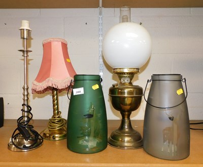 Lot 2068 - A brass oil lamp, with a globular milk glass...