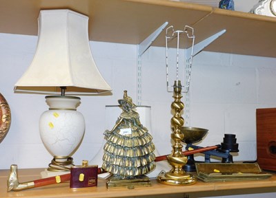 Lot 2081 - A cast brass fireside companion set, the front...