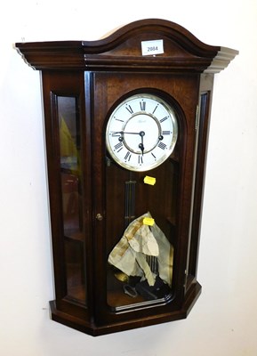 Lot 2084 - A mahogany cased wall clock, the white enamel...