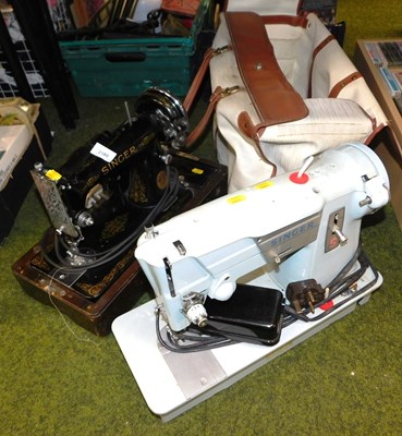 Lot 2180 - A Singer electric sewing machine, lacking case,...