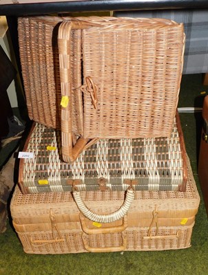 Lot 2202 - A wicker picnic hamper, two others and a cross-...