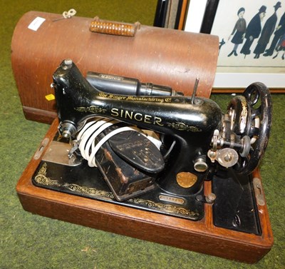 Lot 2204 - A cased Singer sewing machine.