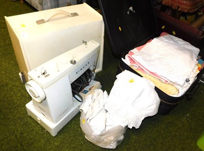 Lot 2209 - A cased sewing machine, together with a...