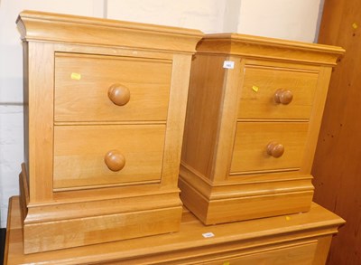 Lot 1003 - A pair of contemporary oak two-drawer bedside...
