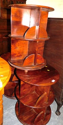 Lot 1057 - A set of three hardwood open bookcases, each...