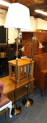Lot 1059 - Two brushed brass standard lamps, one with a...