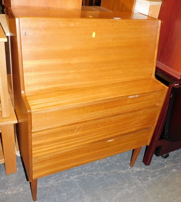 Lot 1060 - A teak bureau, the top with a fall above three...