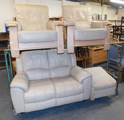Lot 1010 - A cream leather two seater sofa, together with...