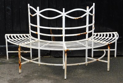 Lot 643 - A white painted metal hearth tree bench, with...