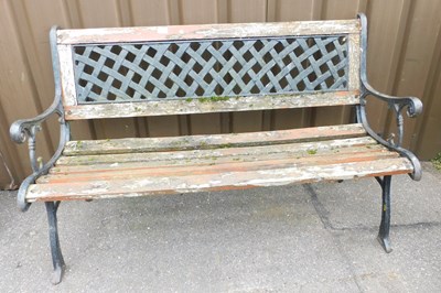 Lot 1094 - A garden bench, with cast metal end supports,...