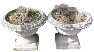 Lot 645 - A pair of composition stone garden...