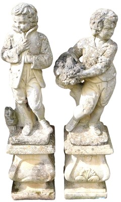 Lot 648 - A pair of garden statues, each modelled as a...