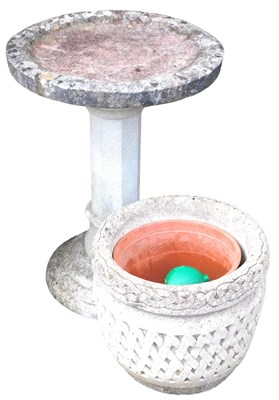 Lot 649 - A composition stone garden birdbath, 59cm high,...