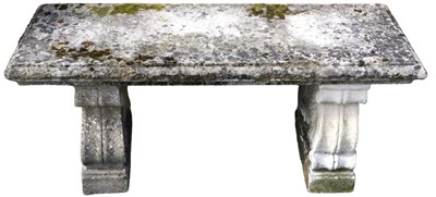 Lot 653 - A composition stone garden bench, the...