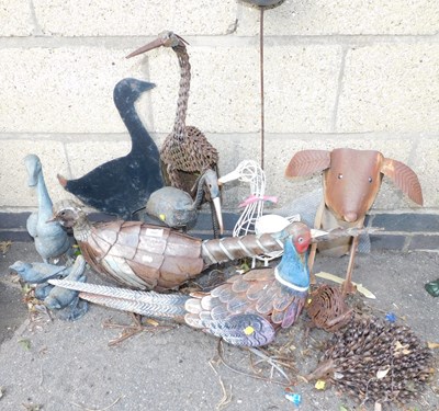 Lot 1097 - A group of metal garden ornaments, to include...
