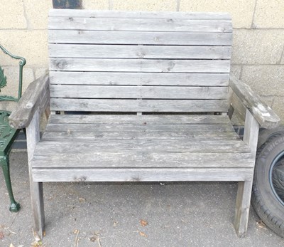 Lot 1098 - A garden bench, with slatted seat and...