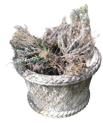 Lot 657 - A composition stone garden planter, of...