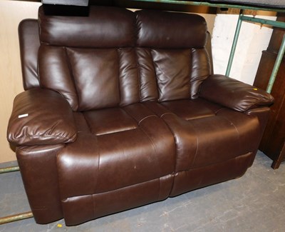 Lot 1020 - A brown leather two-seater manual reclining sofa.