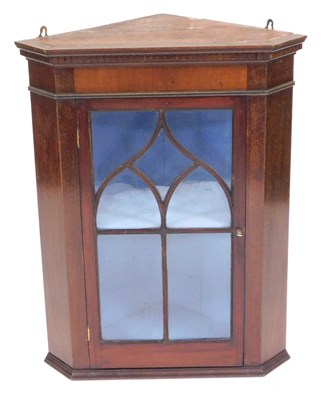 Lot 1026 - A mahogany hanging corner cabinet, the top...