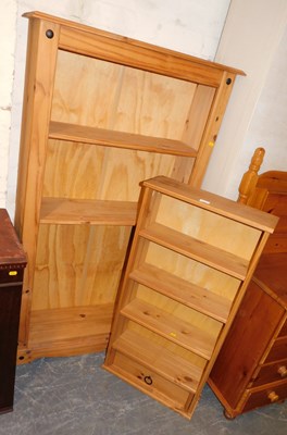 Lot 1027 - A pine open bookcase, with three shelves,...