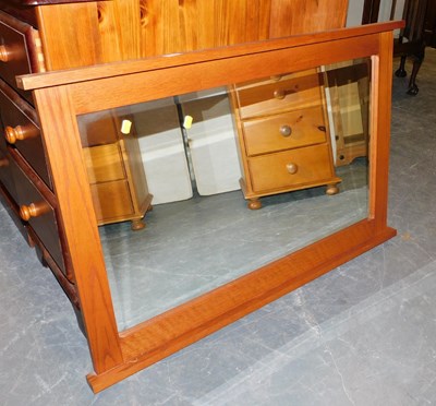 Lot 1042 - An oak framed wall mirror, 66cm x 100cm.