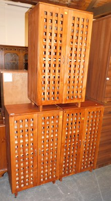 Lot 1043 - A set of three shelving units, each with...
