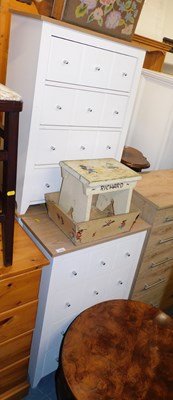 Lot 1046 - A set of three four drawer chests, 83cm high,...