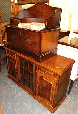 Lot 1050 - An oak telephone table, together with an oak...