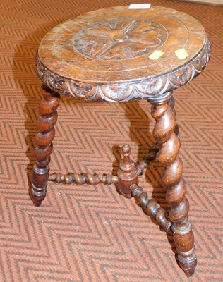 Lot 2241 - A carved and turned 20thC wooden stool, with...