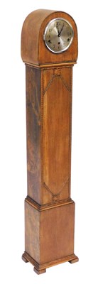 Lot 770 - A 1930s oak grandmother clock, silvered dial...