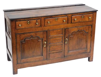 Lot 777 - An early 18thC oak dresser base, with three...